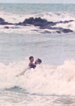 Christopher and Winner in the waves